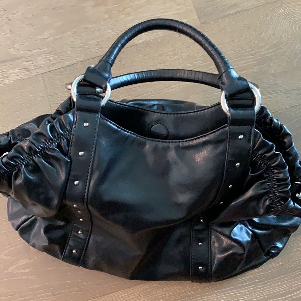 Black, pink interior studded hand/shoulder bag